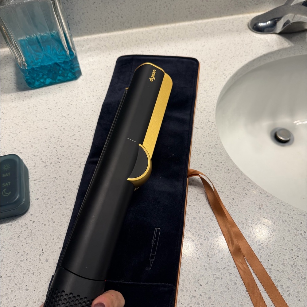 Dyson black and gold airstrait
